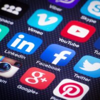 Social media icon buttons on a phone Social media icon buttons on a phone